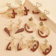 Wholesale Unique Wood Stitching Resin Valentine s Day Love Earrings Women s Simple All-match Round Heart-shaped Hollow Earrings Online Hot Sale