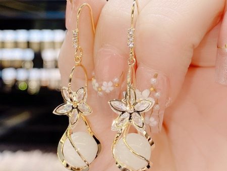 Wholesale Zircon Five Petal Flower Cat Eye Stone Personalized Fashion Temperament Earrings Online